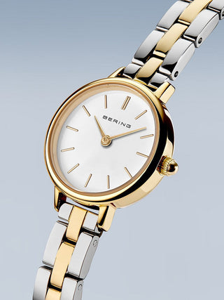 Angle shot of Bering 11022-714 White Dial Gold Stainless Steel Womens Watch on white background