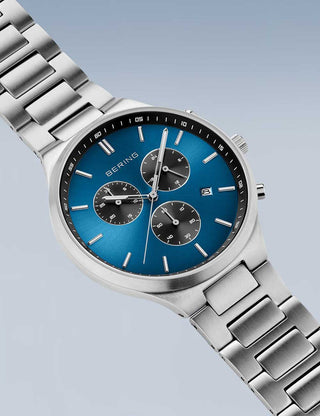 Angle shot of Bering Chronograph 11743-707 Blue Dial Silver Titanium Unisex Watch on white background