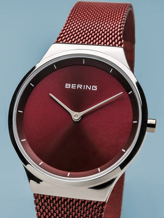 Angle shot of Bering 12131-303 Red Dial Stainless Steel Womens Watch on white background