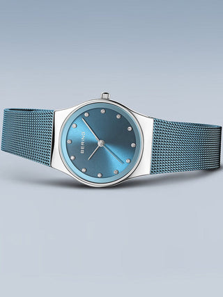 Angle shot of Bering 12927-308 Blue Stainless Steel Womens Watch on white background