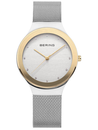 Angle shot of Bering 12934-010 Gold Dial Silver Stainless Steel Womens Watch on white background