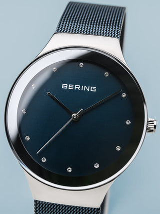 Angle shot of Bering 12934-307 Blue Stainless Steel Womens Watch on white background