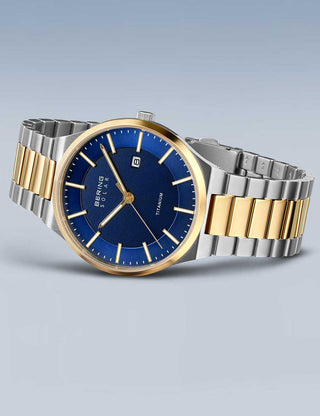 Angle shot of Bering 14439-717 Blue Dial Gold Titanium Unisex Watch on white background