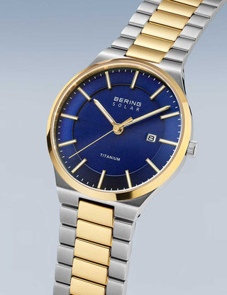 Angle shot of Bering 14439-717 Blue Dial Gold Titanium Unisex Watch on white background