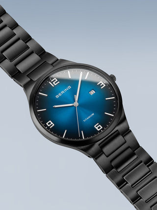 Angle shot of Bering 15240-727 Blue Dial Black Titanium Unisex Watch on white background