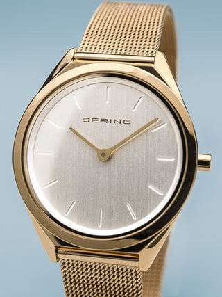 Angle shot of Bering 17031-334 Silver Dial Gold Stainless Steel Womens Watch on white background