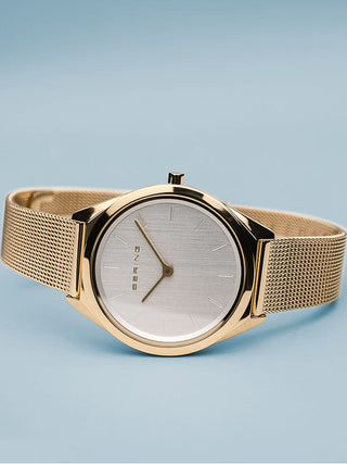 Angle shot of Bering 17031-334 Silver Dial Gold Stainless Steel Womens Watch on white background