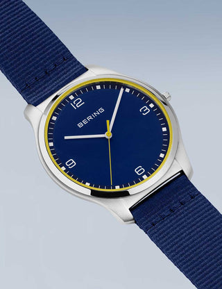 Angle shot of Bering 18342-507 Blue Textile Unisex Watch on white background