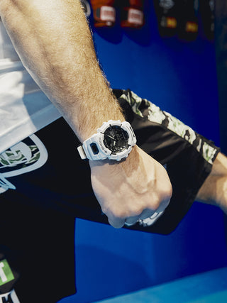 Angle shot of Casio G-Shock GBA-900-7AER Black Dial White Resin Mens Watch on white background