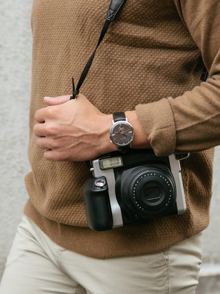 Angle shot of Bulova Aerojet 98A187 Grey Dial Black Leather Unisex Watch on white background