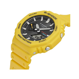 Angle shot of Casio G-Shock GA-B2100C-9AER Black Dial Yellow Resin Mens Watch on white background