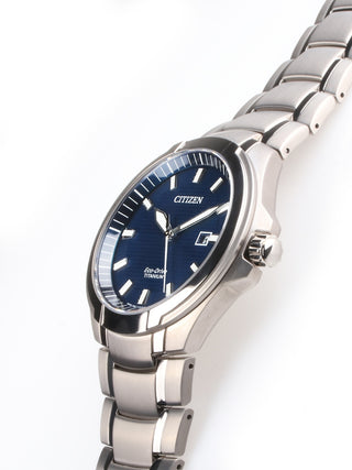 Angle shot of Citizen BM7430-89L Blue Dial Silver Titanium Unisex Watch on white background