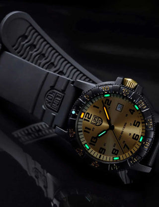 Angle shot of Luminox XS.0325.GP Gold Dial Black Silicone Unisex Watch on white background